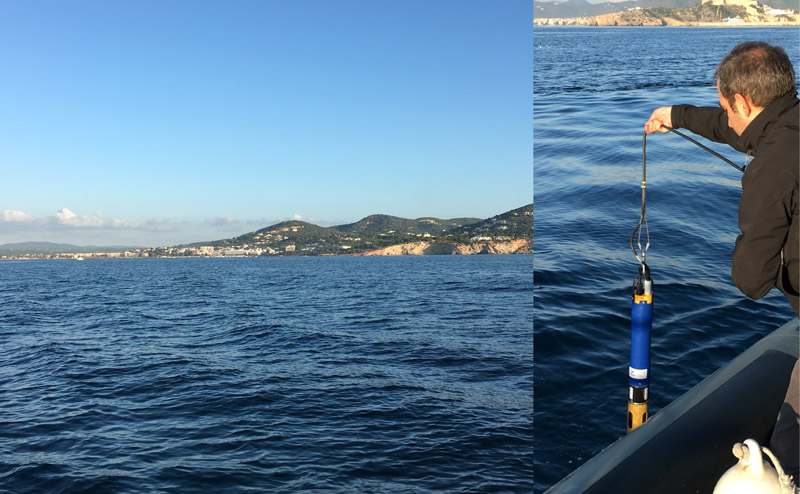 Técnico sumerge sonda en el mar para estudio oceanográfico